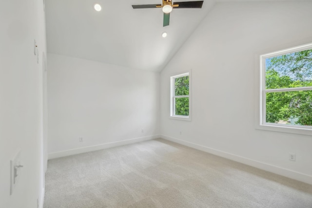 spare room with lofted ceiling, baseboards, ceiling fan, light colored carpet, and recessed lighting