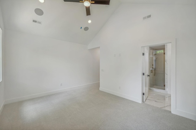 unfurnished bedroom with high vaulted ceiling, baseboards, carpet, and visible vents