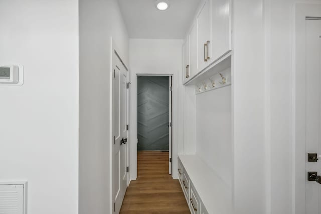 mudroom with recessed lighting and dark wood-style floors