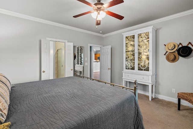carpeted bedroom featuring crown molding, baseboards, and ceiling fan