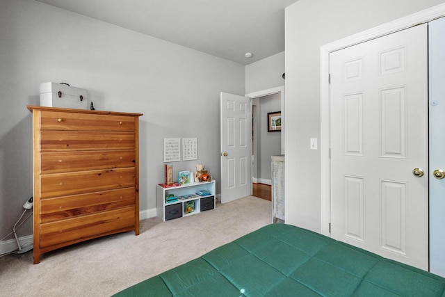 carpeted bedroom with baseboards