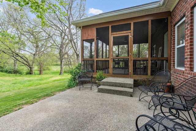 view of patio featuring a sunroom