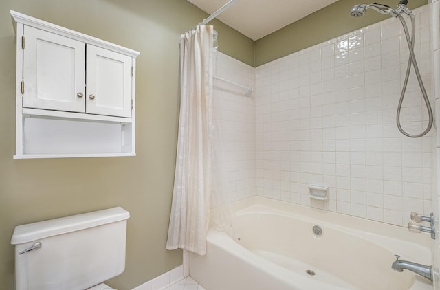 bathroom with toilet, baseboards, and shower / bathtub combination with curtain
