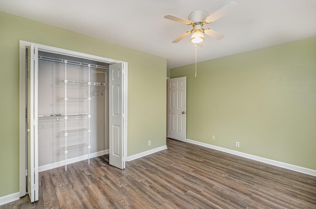 unfurnished bedroom with a closet, a ceiling fan, baseboards, and wood finished floors