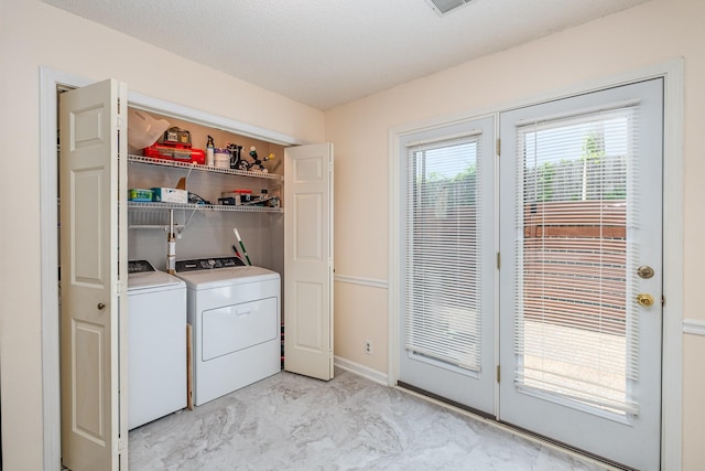 washroom with washer and dryer, laundry area, baseboards, and marble finish floor