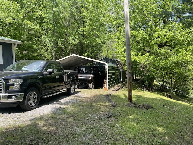 view of parking / parking lot featuring a carport and driveway