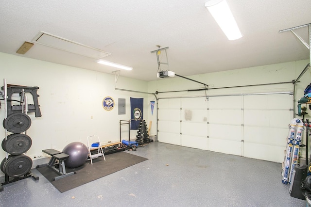garage featuring a garage door opener and electric panel