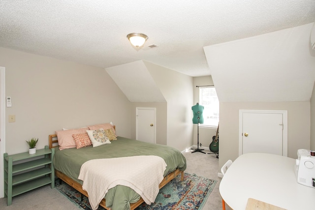 bedroom with light colored carpet, baseboards, a textured ceiling, and lofted ceiling