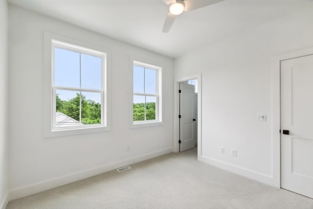 unfurnished bedroom with visible vents, carpet, baseboards, and a ceiling fan