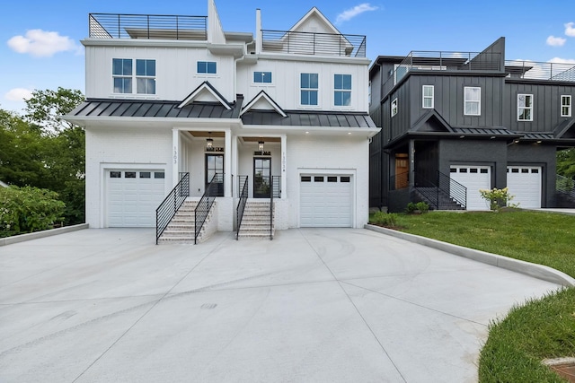 view of front facade featuring concrete driveway, brick siding, a standing seam roof, and a garage