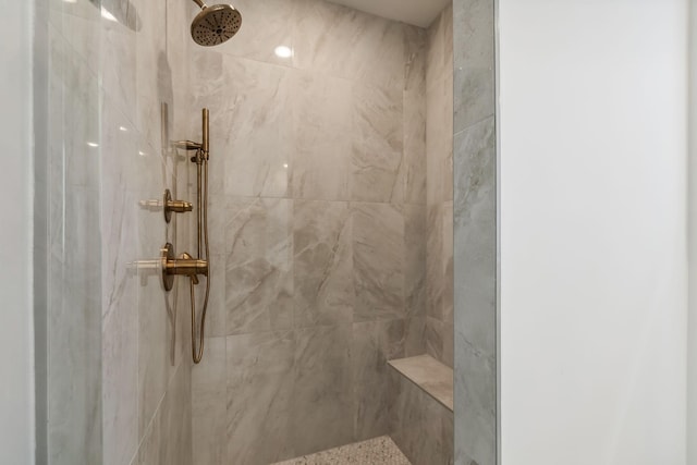 full bathroom with tiled shower