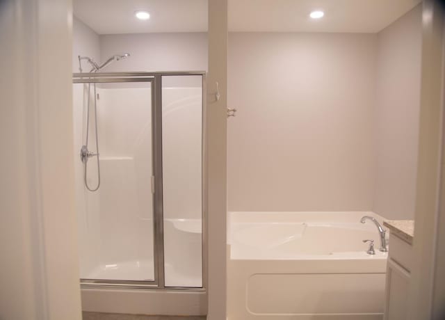 319 Mattie Ln, Spring Hill, TN 37174 - bathroom featuring a shower stall, recessed lighting, and a bath