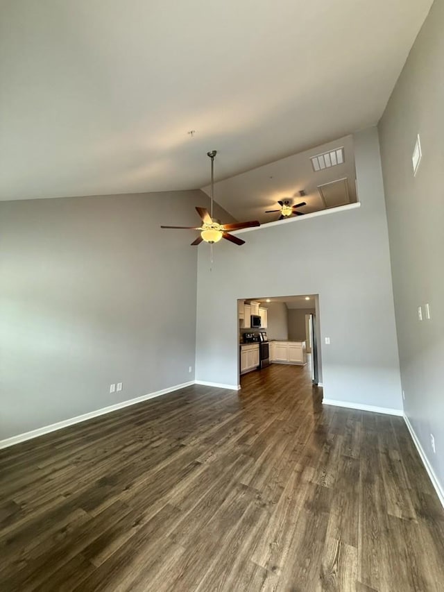 319 Mattie Ln, Spring Hill, TN 37174 - unfurnished living room with dark wood-style flooring, attic access, a ceiling fan, baseboards, and visible vents