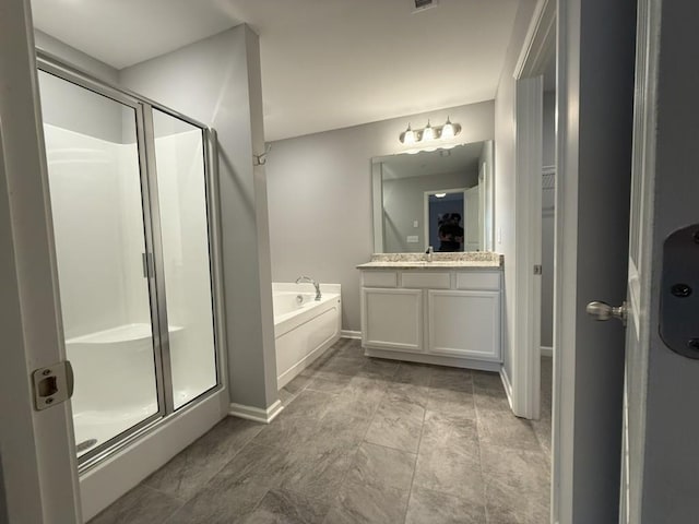 319 Mattie Ln, Spring Hill, TN 37174 - full bath featuring vanity, baseboards, a stall shower, and a garden tub