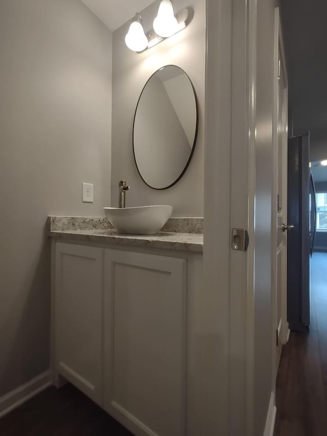 319 Mattie Ln, Spring Hill, TN 37174 - bathroom featuring vanity, baseboards, and wood finished floors