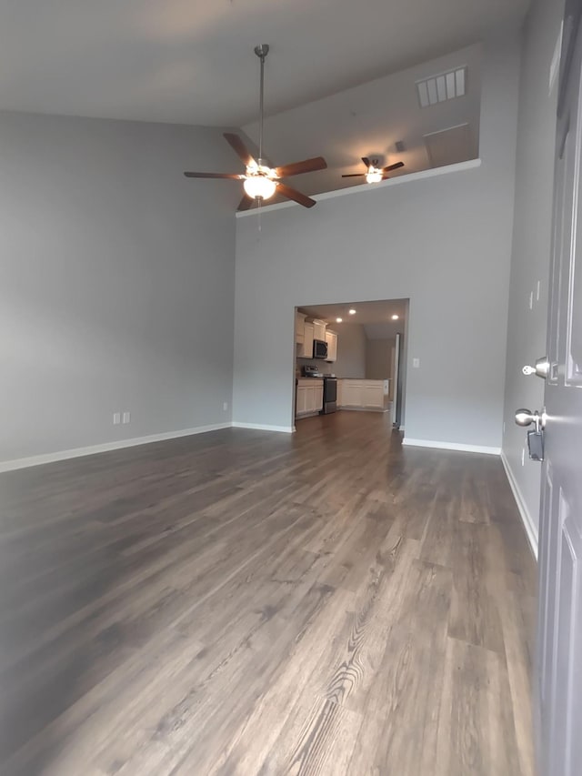 319 Mattie Ln, Spring Hill, TN 37174 - spare room with visible vents, baseboards, dark wood-style floors, and high vaulted ceiling