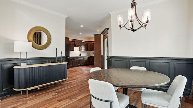 1210 Macey Peri Way, Smyrna, TN 37167 - dining space featuring ornamental molding, a chandelier, light wood-style flooring, a wainscoted wall, and recessed lighting