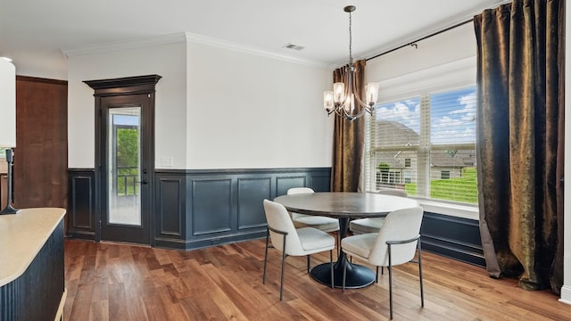 1210 Macey Peri Way, Smyrna, TN 37167 - dining area featuring a chandelier, wood finished floors, healthy amount of natural light, a wainscoted wall, and ornamental molding