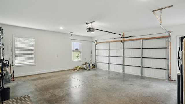 1210 Macey Peri Way, Smyrna, TN 37167 - garage featuring a garage door opener, recessed lighting, and baseboards
