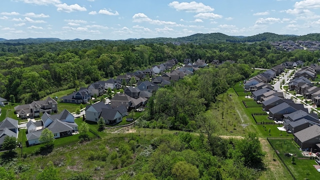 aerial view with a wooded view and a residential view