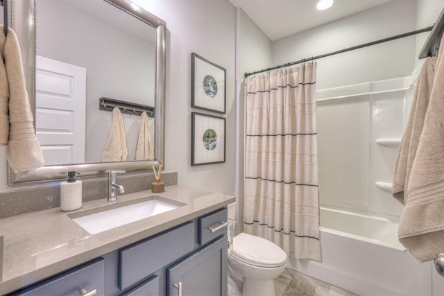 bathroom with vanity, shower / bathtub combination with curtain, and toilet