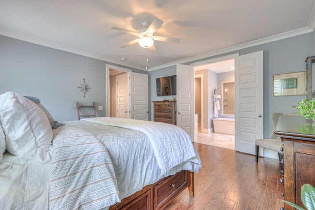 bedroom with crown molding, ensuite bathroom, wood finished floors, and ceiling fan