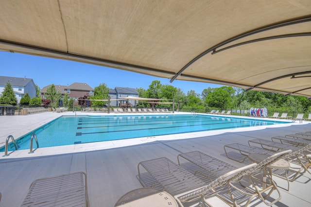 pool featuring a patio and fence