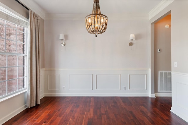 unfurnished dining area with an inviting chandelier, wainscoting, dark wood-style flooring, and visible vents