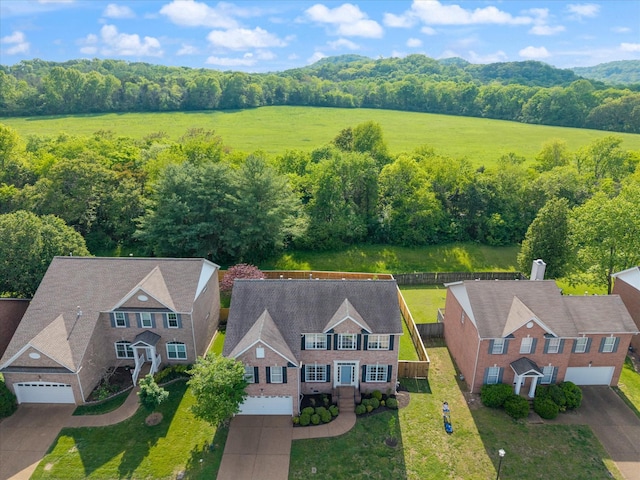 bird's eye view featuring a wooded view