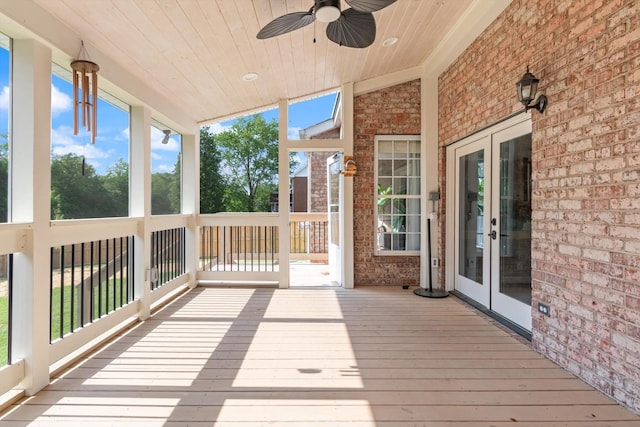 wooden terrace featuring a ceiling fan and french doors