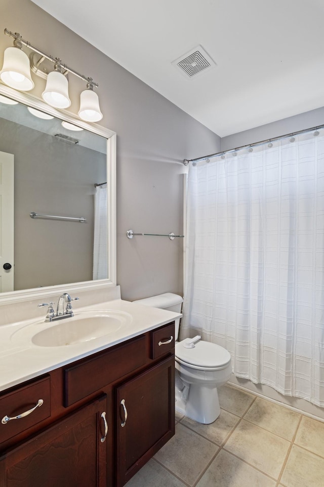 260 Wisteria Dr, Franklin, TN 37064 - full bath with vanity, toilet, tile patterned floors, a shower with shower curtain, and visible vents
