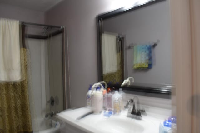 full bath with a sink and shower / bath combination with curtain