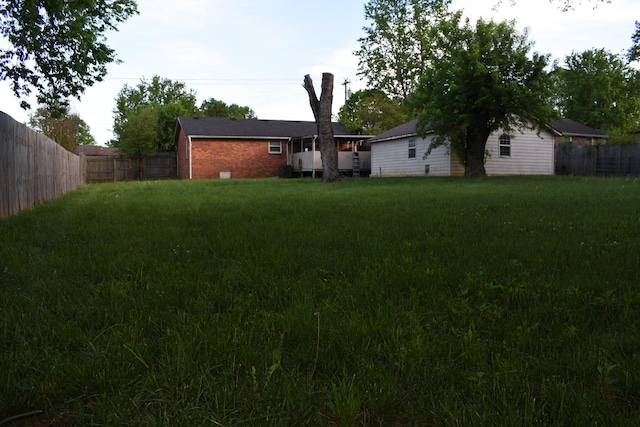 view of yard featuring a fenced backyard