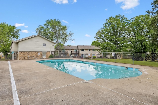 community pool featuring fence