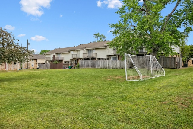 view of yard with fence and a residential view