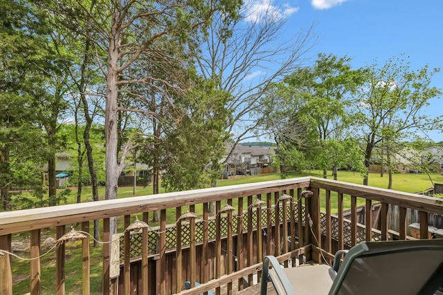 wooden deck with a yard