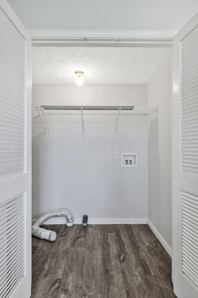 laundry area featuring baseboards, laundry area, wood finished floors, and hookup for a washing machine
