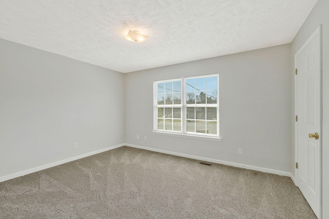 unfurnished bedroom featuring carpet floors, baseboards, and visible vents