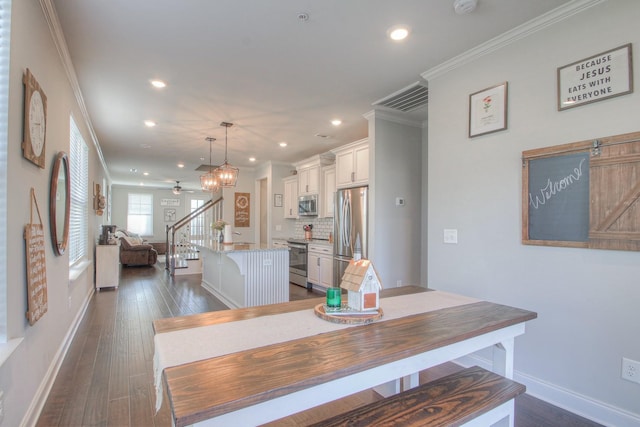 dining space featuring visible vents, ornamental molding, baseboards, stairway, and recessed lighting