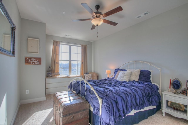 bedroom featuring carpet floors, a ceiling fan, baseboards, and visible vents