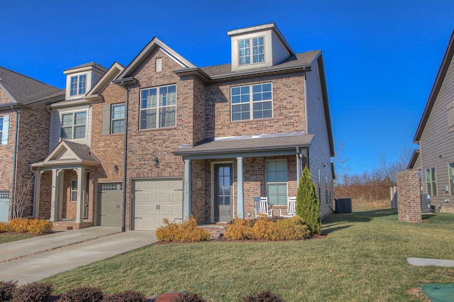 view of front of home with concrete driveway, brick siding, a front yard, and a garage