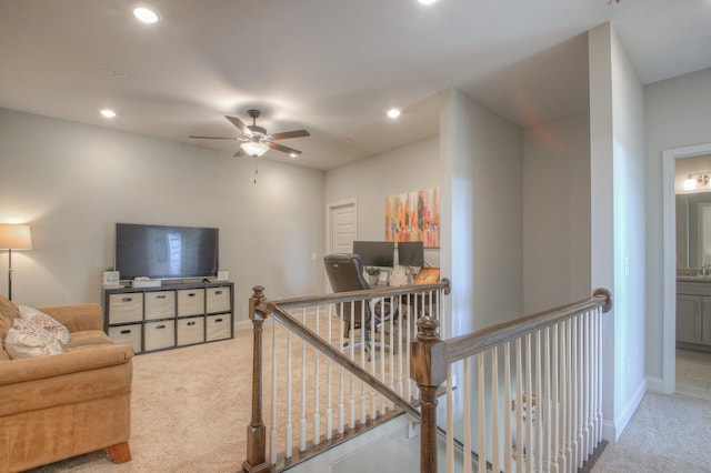 living area featuring recessed lighting, ceiling fan, light colored carpet, and baseboards