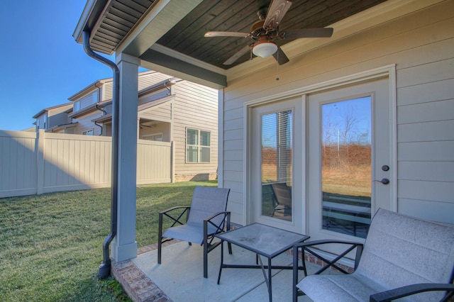 view of patio / terrace featuring ceiling fan and fence
