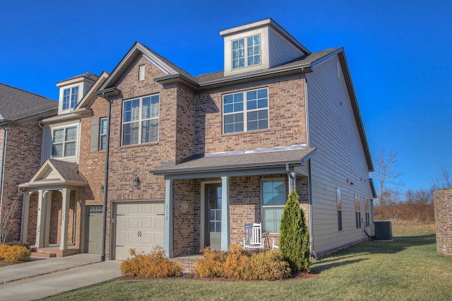 view of front of property with brick siding, driveway, a front lawn, and a garage
