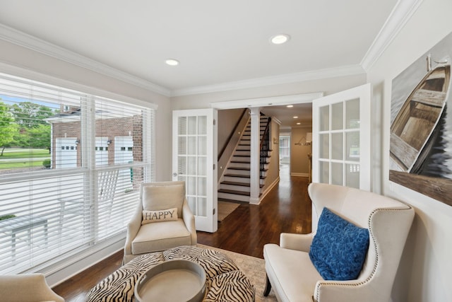living area with recessed lighting, ornamental molding, and wood finished floors