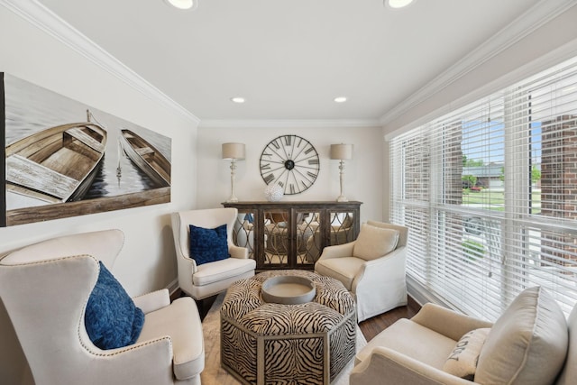 living area featuring baseboards, ornamental molding, recessed lighting, and wood finished floors