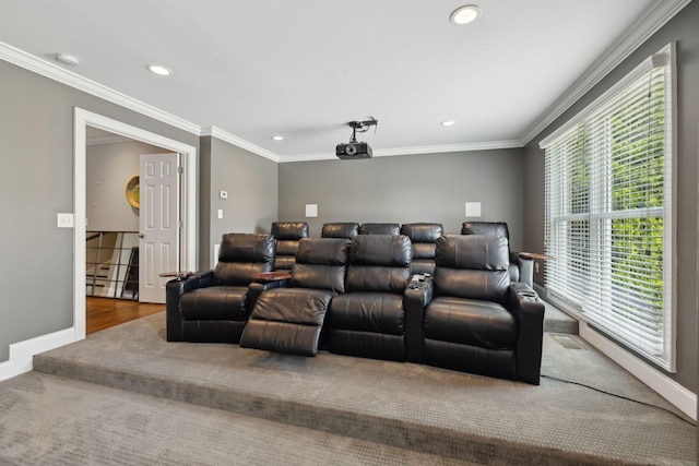 carpeted home theater room featuring crown molding, recessed lighting, and baseboards