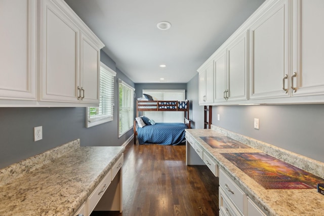 bedroom with recessed lighting and dark wood-type flooring
