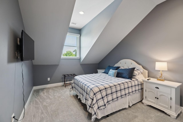 bedroom featuring baseboards, visible vents, and light colored carpet