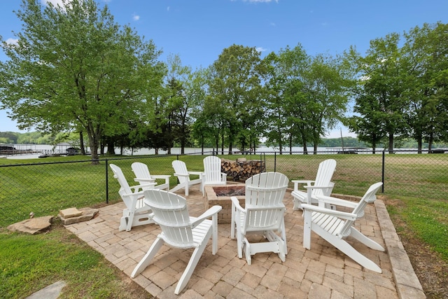 view of patio / terrace with a fire pit and fence
